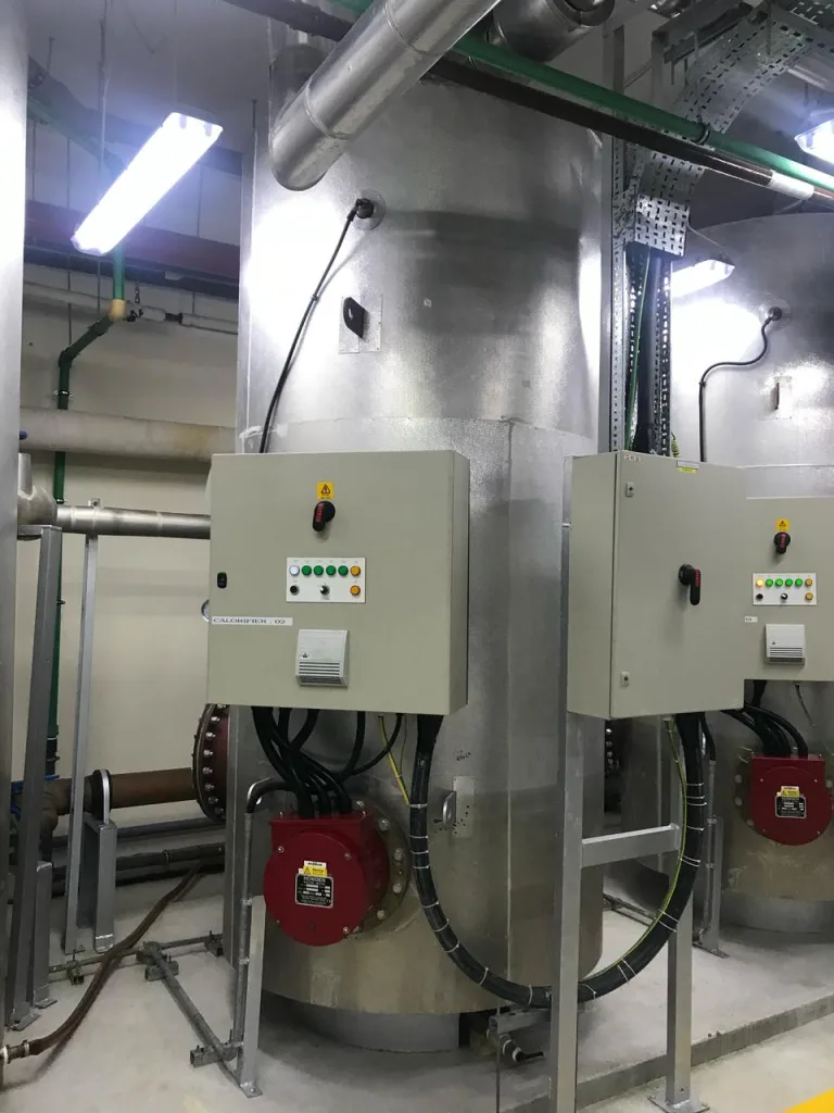 Calorifiers with control panels in a building plant room