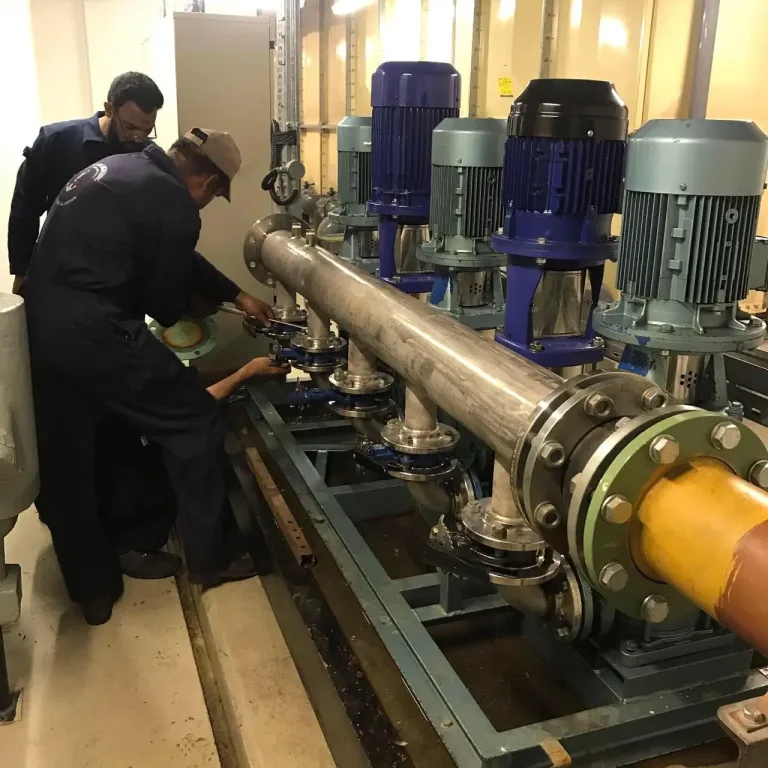 Technicians assembling a pump drive in the machine shop
