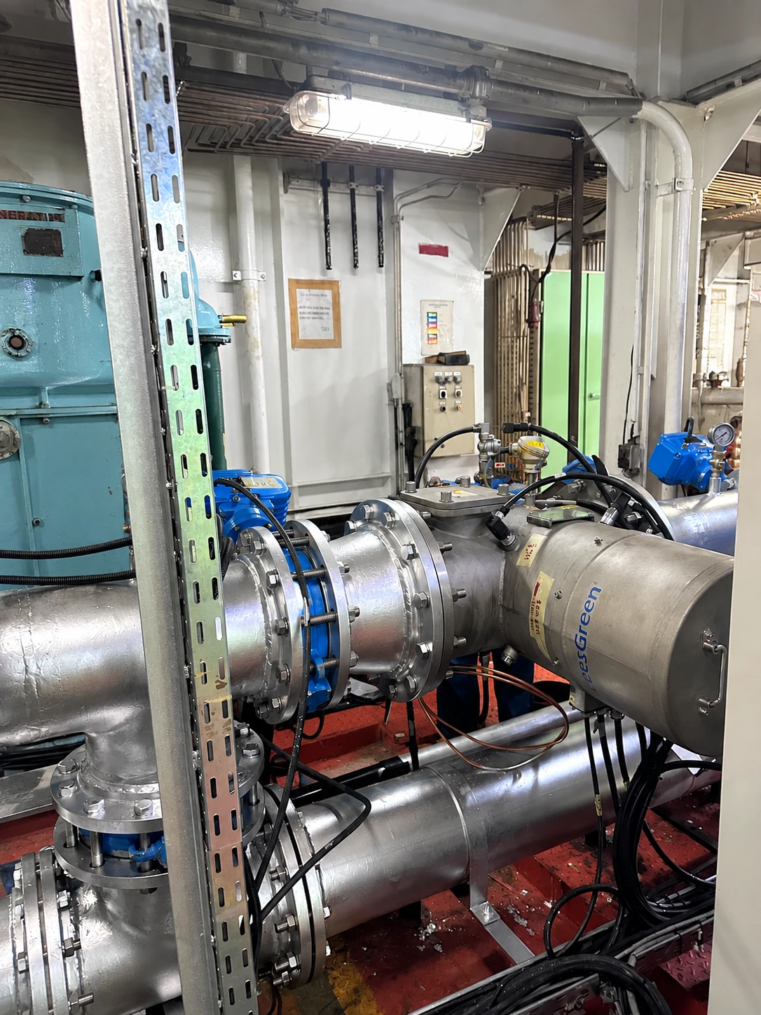 Ballast water treatment system installed in a ship’s engine room, with flanged stainless steel pipe spools and actuated valves