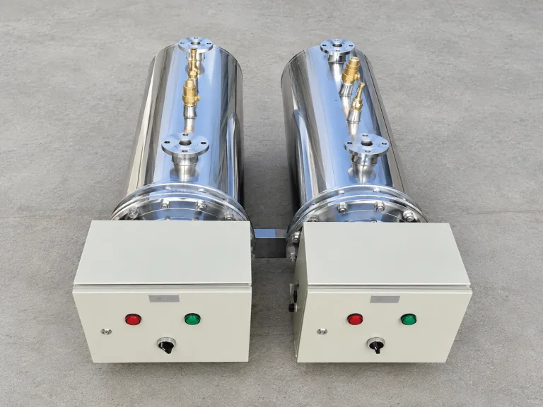 Two inline circulation heaters with their control panels, manufactured in Dubai